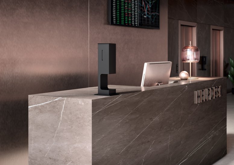 Modern reception counter with a touch-free disinfectant dispenser in matt black stainless steel